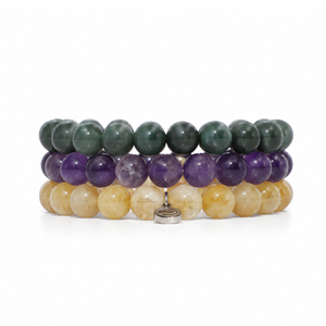 Three stacked beaded bracelets made of polished round gemstone beads, with dark green, purple, and light yellow beads, shown on a white background.