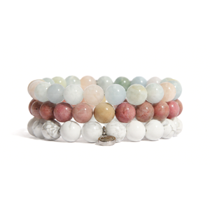 three bracelets on a white background