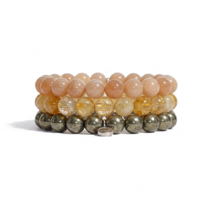 three bracelets on a white background