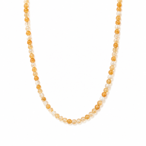 yellow beaded necklace on a white background with small  beads