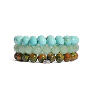 three bracelets on a white background