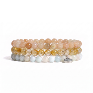three bracelets on a white background