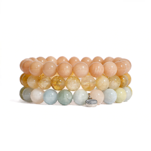three bracelets on a white background