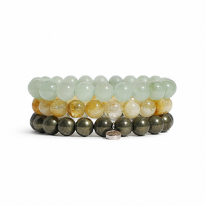 Three stacked beaded stretch bracelets on a white background. The top bracelet is made of pale green translucent beads, the middle is made of golden-yellow translucent beads, and the bottom is made of metallic olive-green beads.