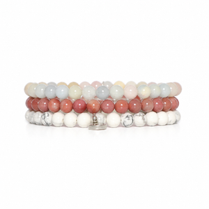 three bracelets on a white background