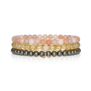 three bracelets on a white background