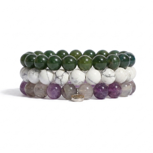 three bracelets on awhite background